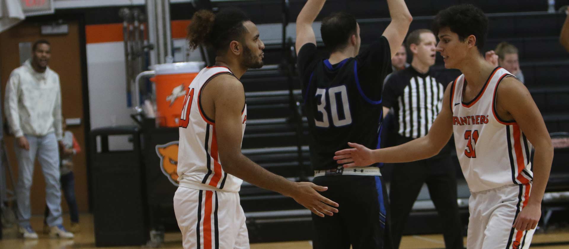 Men's basketball topped by Millikin