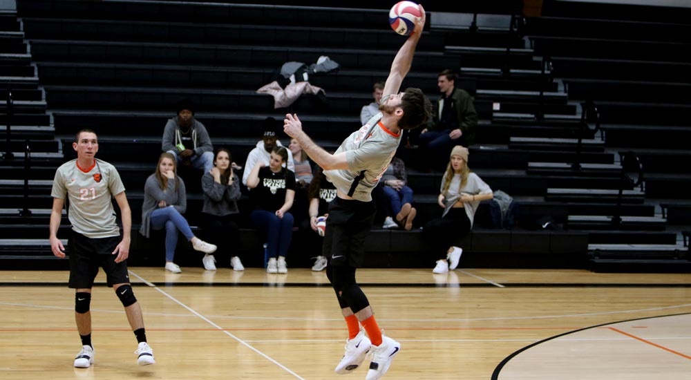 Men's volleyball splits home opening night matches